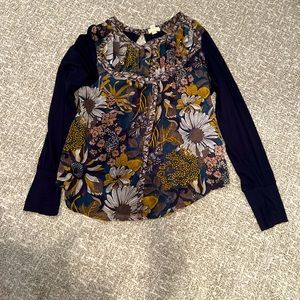 TINY blouse. Print front with solid navy sleeve. Gently worn
